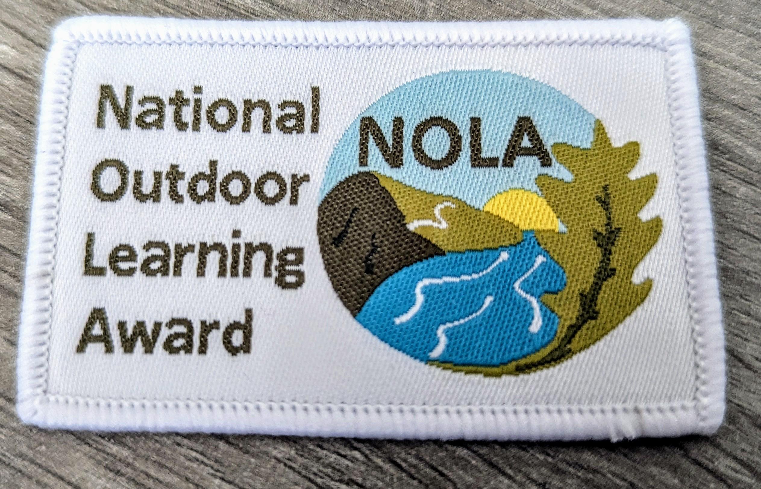 NOLA Badge - Cloth.jpg
